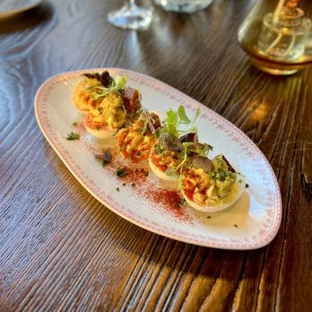 Scholar Grand Rapids signature dishes Deviled Eggs, Butternut Squash and Sweet Potato Bisque, Bison Short Ribs, Cedar Plank Salmon